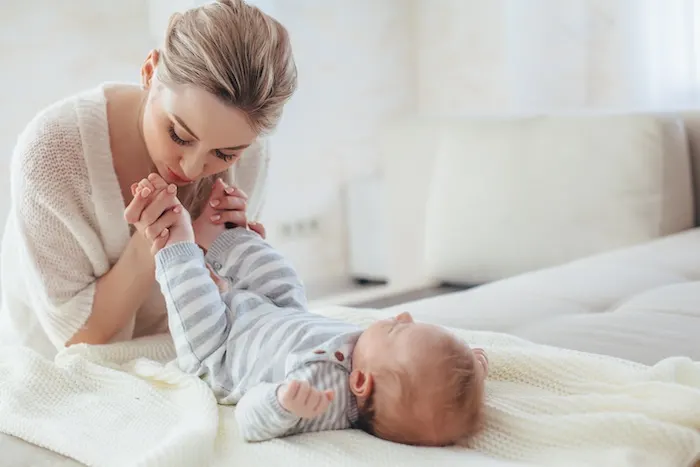 mom playing with baby during the day, which helps baby who has days and nights mixed up