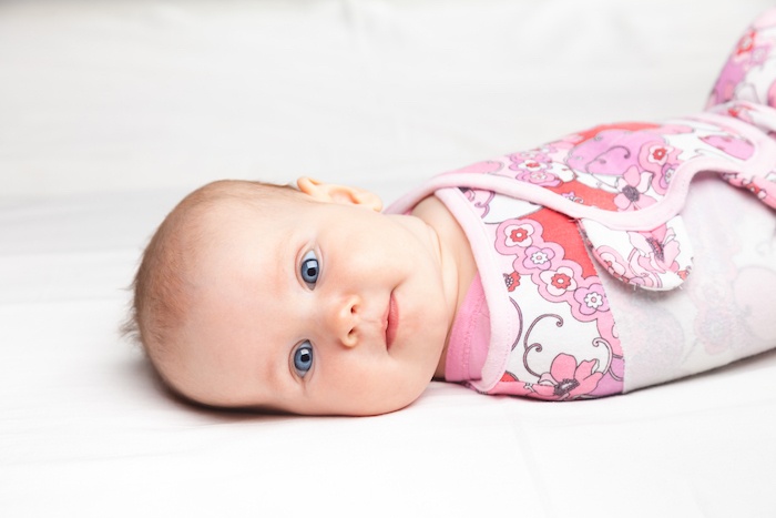 when to stop swaddling baby