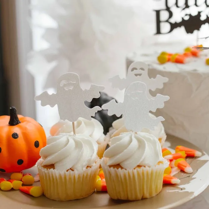 halloween cupcakes with ghosts for spooky fall baby shower theme