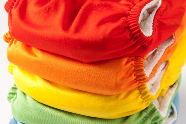 stack of colorful baby cloth diapers