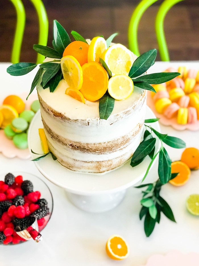citrus baby shower cake topped with lemon