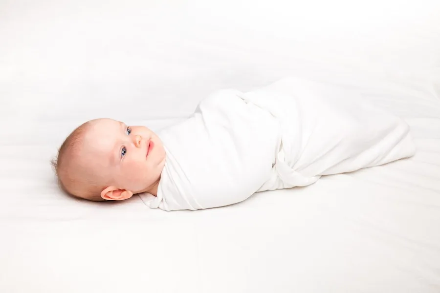 how to dress baby for sleep swaddled baby