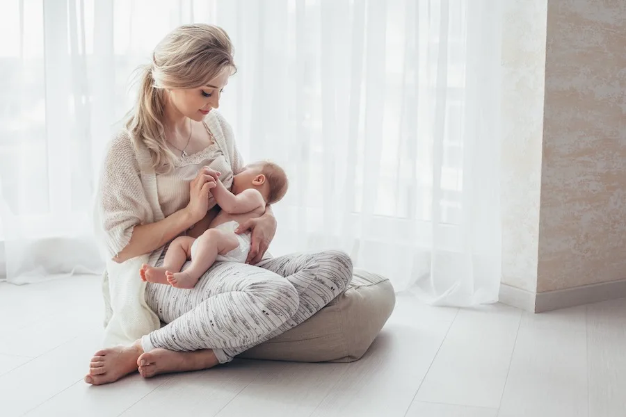 postpartum clothing essentials - mom nursing newborn