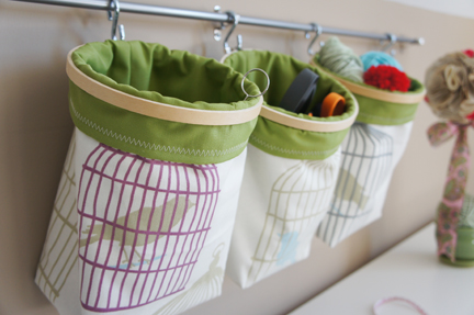 small nursery ideas - storage bags on wall