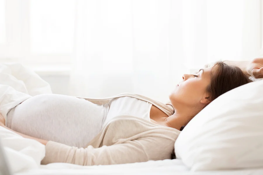 pregnant woman sleeping, sleep position is an old wives tale of baby's gender