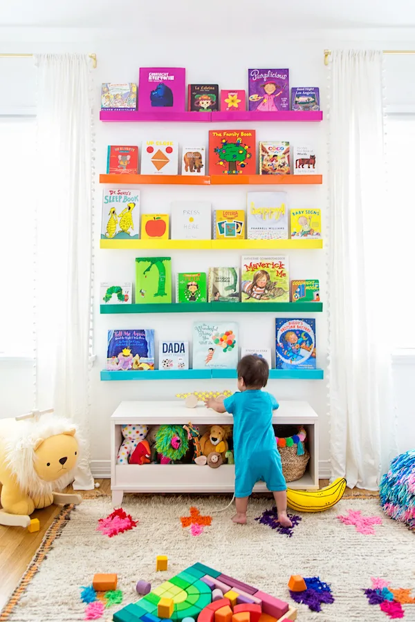 rainbow bookshelves in nursery