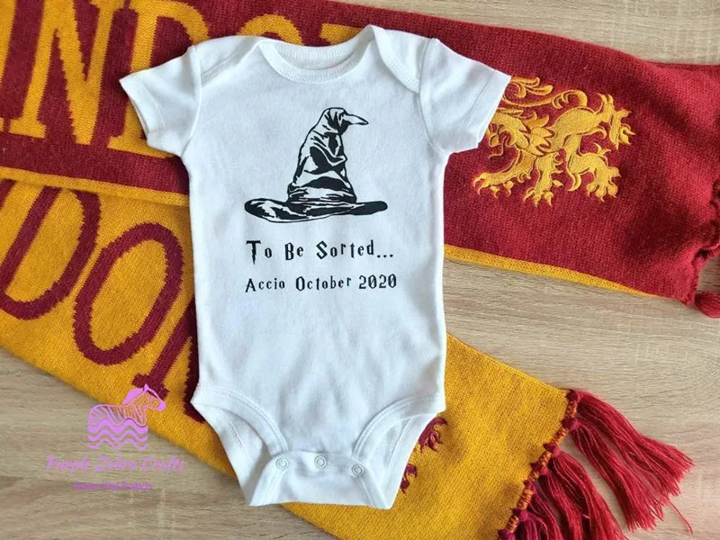 Harry Potter onesie announcing new baby