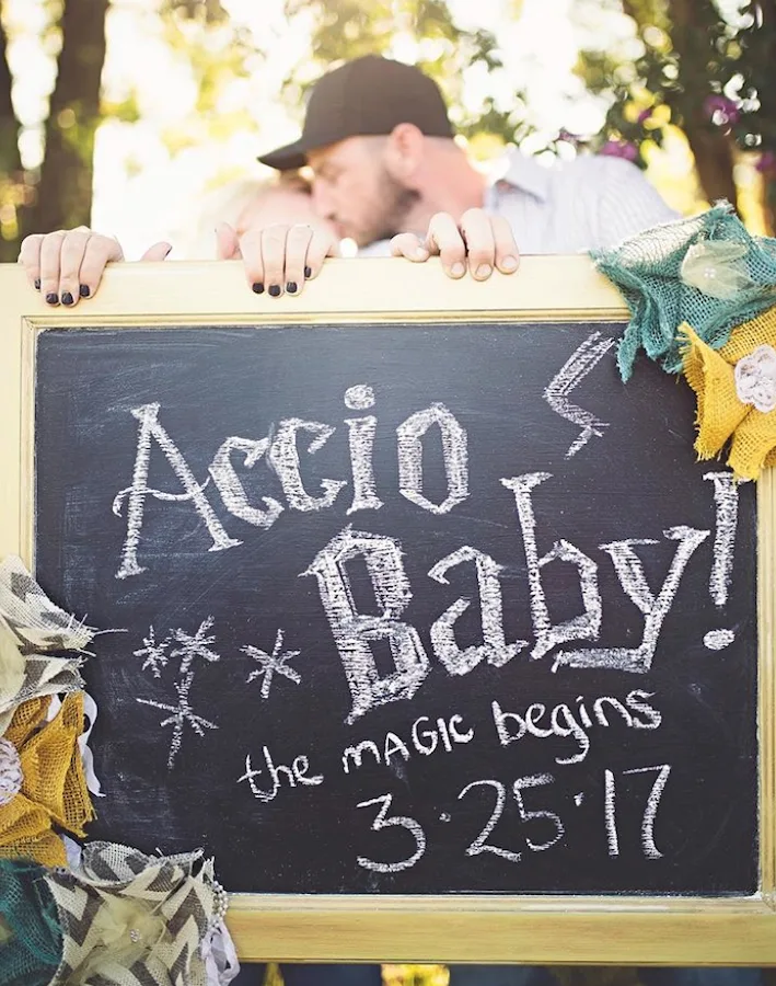 Accio Baby Harry Potter pregnancy announcement with parents holding sign