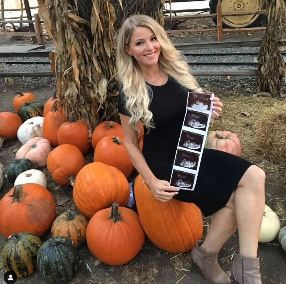 Halloween pregnancy announcement at pumpkin patch