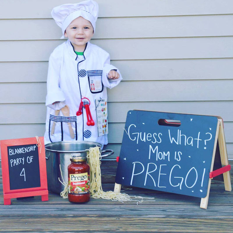 funny pregnancy announcement photo with kid chef