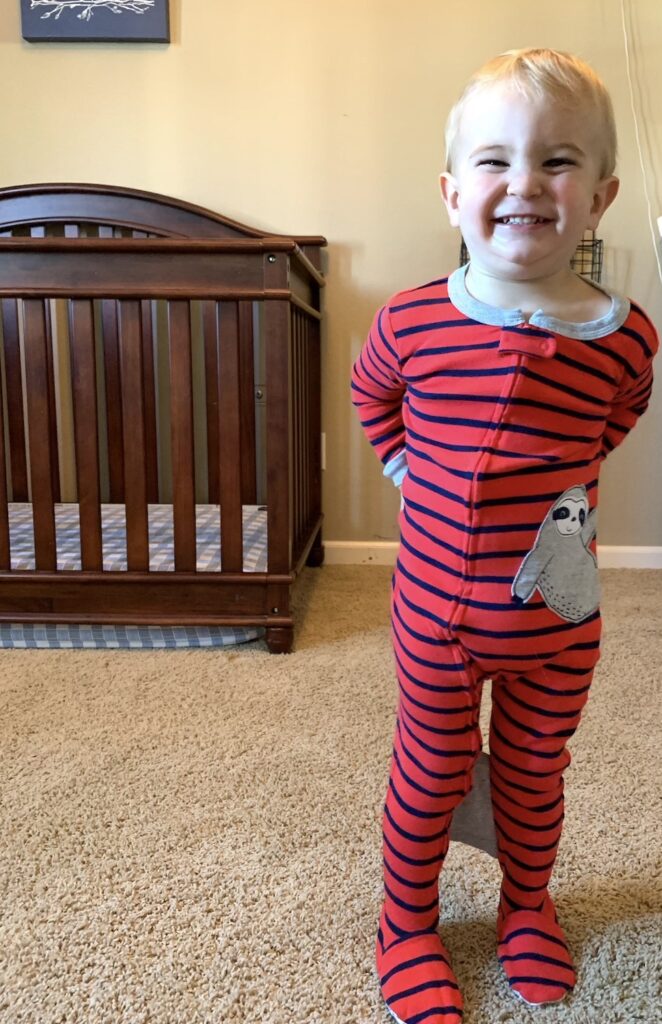 Kid climbing outlet out of crib