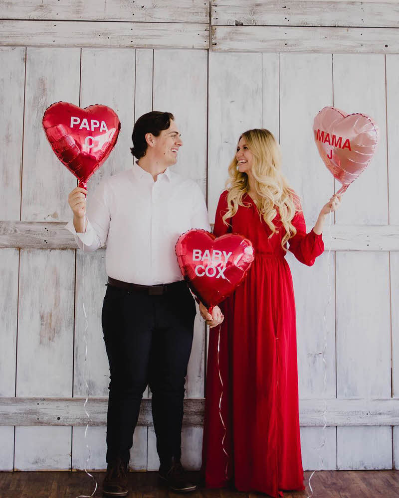 Valentine's Day pregnancy announcement with balloons