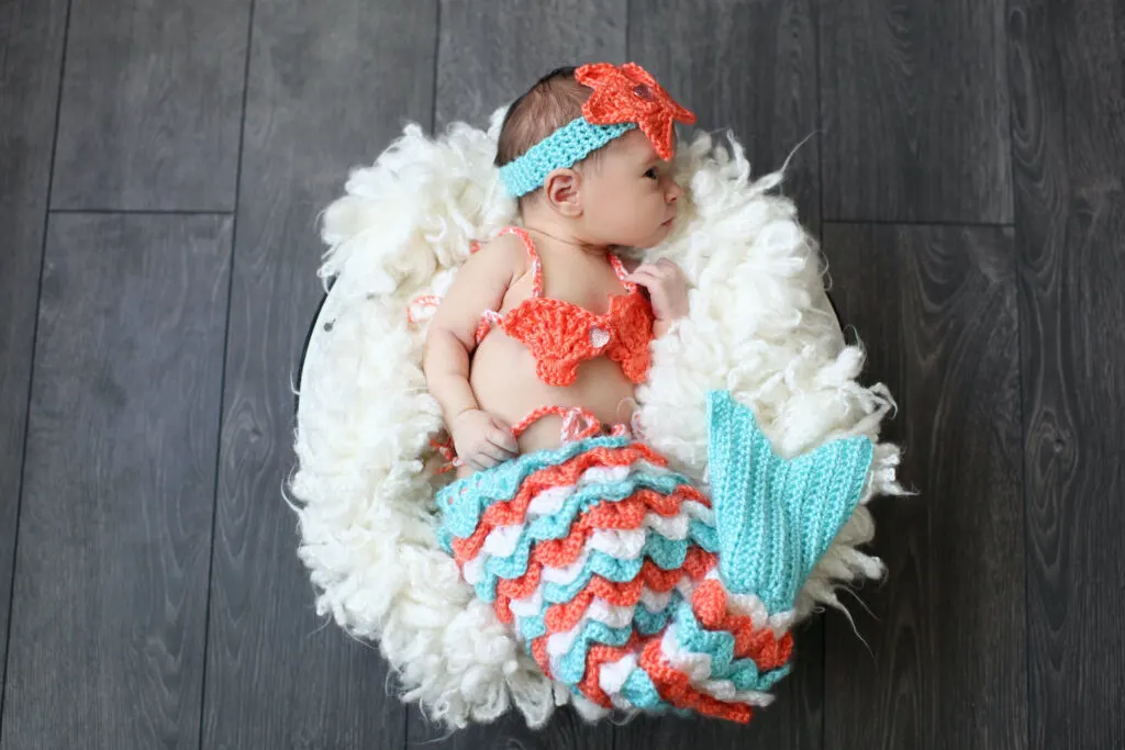 newborn baby dressed in Mermaid costume - when to take newborn photos