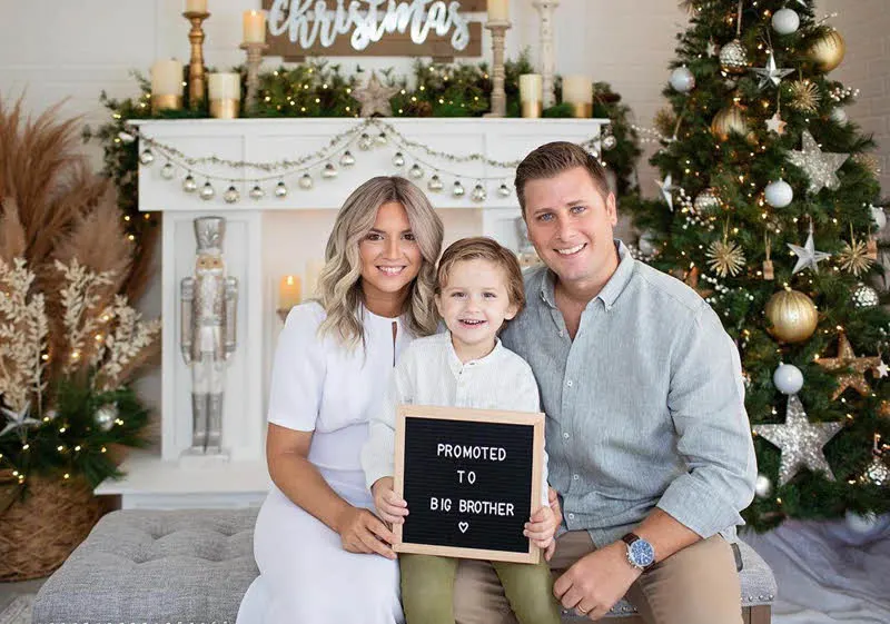 Christmas family photo holding big brother letter board sign