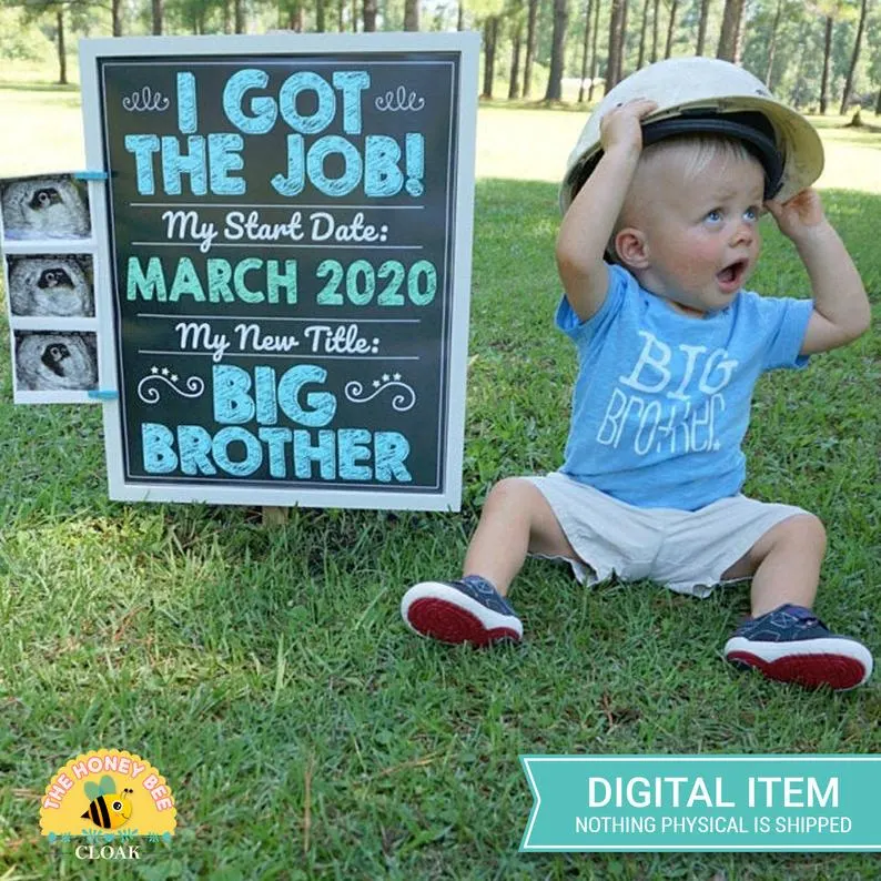 baby boy with promoted to big brother sign