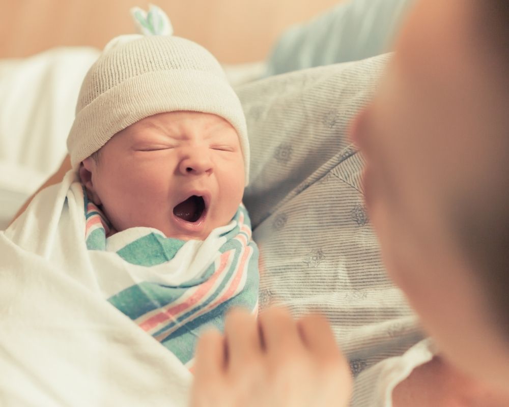 newborn baby yawning after wake window