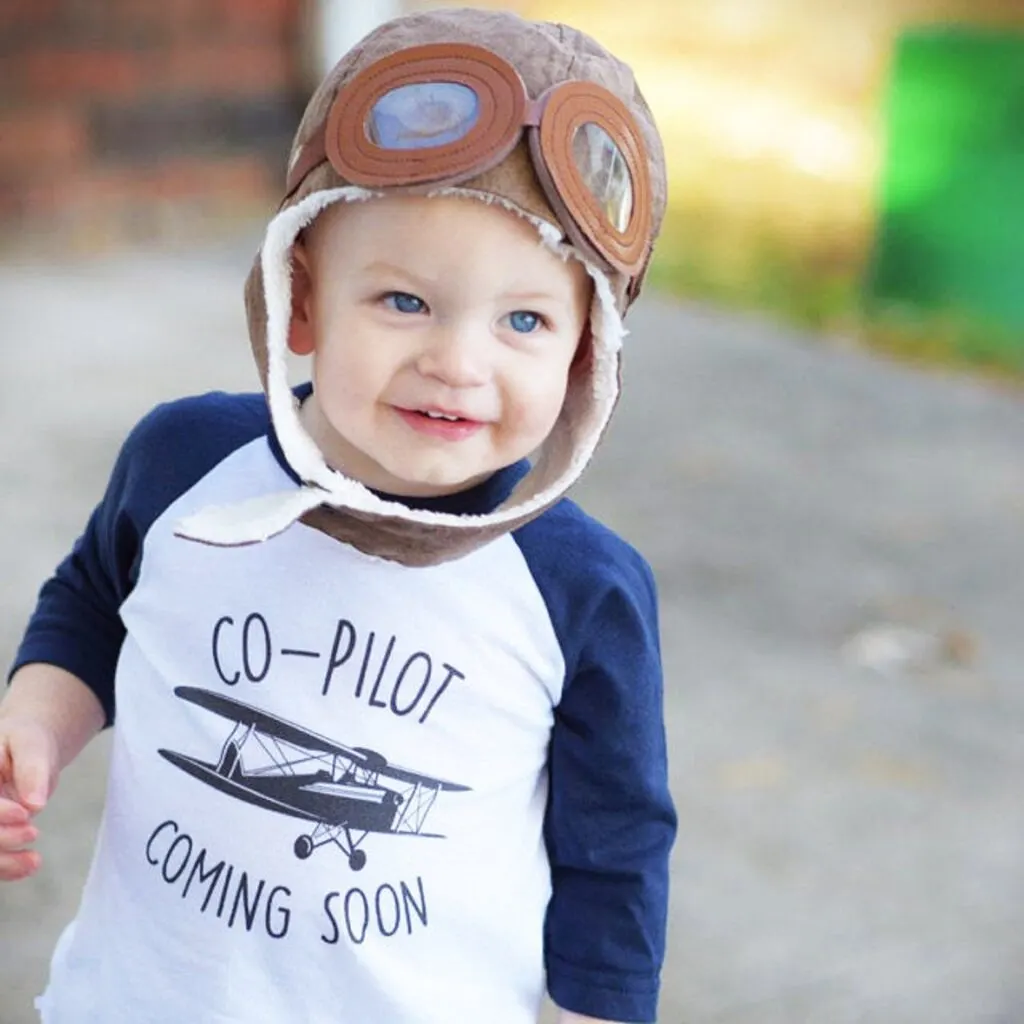 baby boy wearing co-pilot shirt and hat