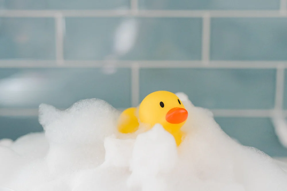 bubble bath with yellow rubber ducky
