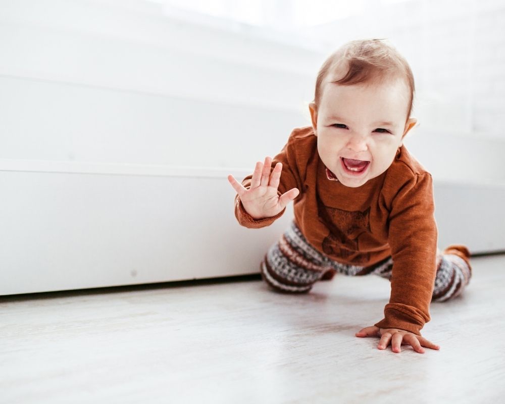 baby crawling and smiling