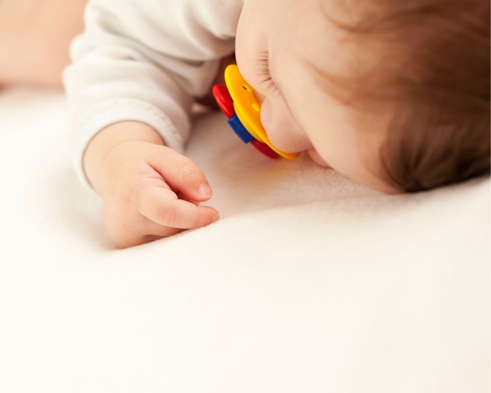 Baby rolling over in deals bed and waking up