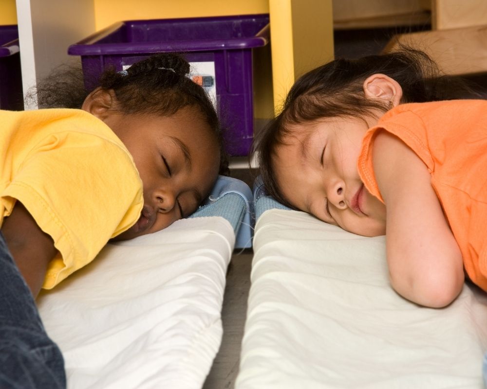 Three year olds napping during their preschool schedule
