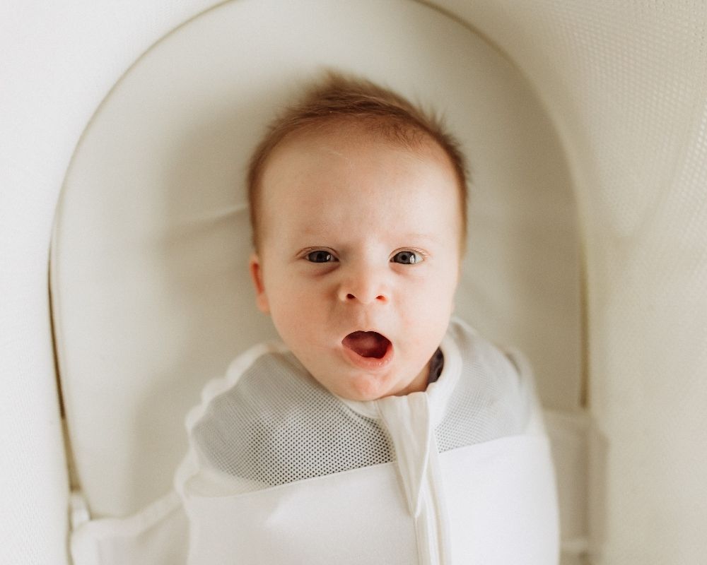 baby in a SNOO smart bassinet
