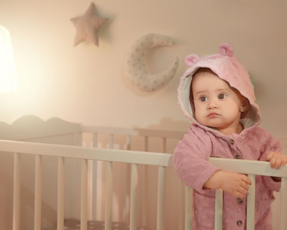 baby standing up in crib