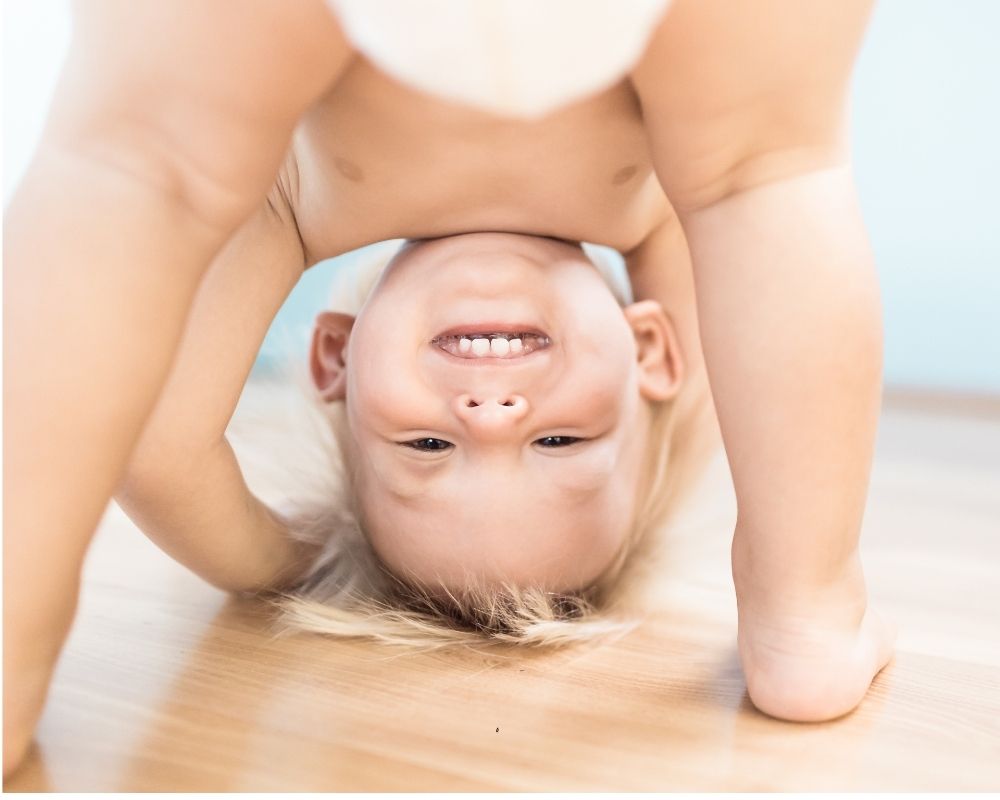 12 month old standing upside down