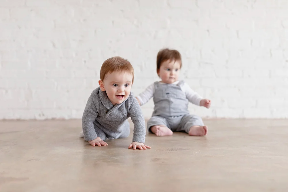 baby boys crawling and sitting up