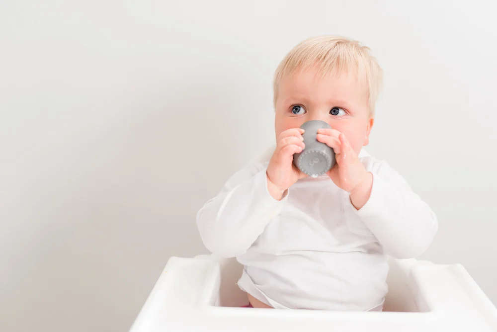 baby drinking from a cup when starting baby led weaning