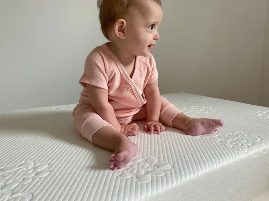 baby awake on crib mattress