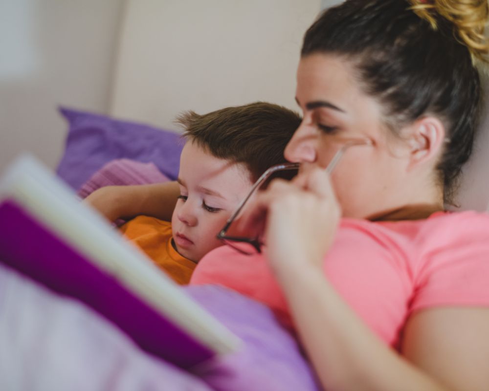 mom and son reading books as part of bedtime routine