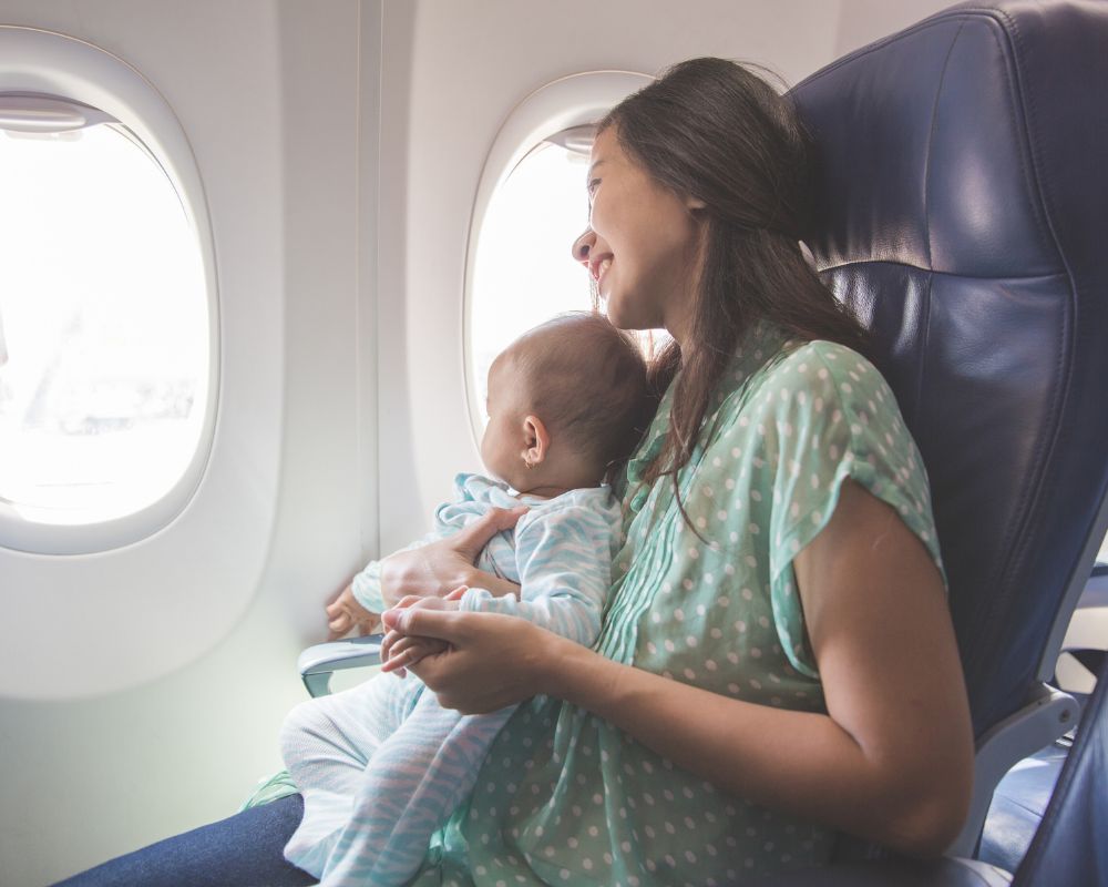 mom and baby flying on airplane