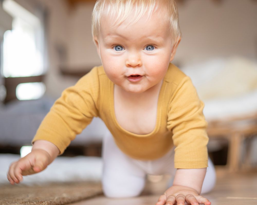 10 month old baby crawling on the floor