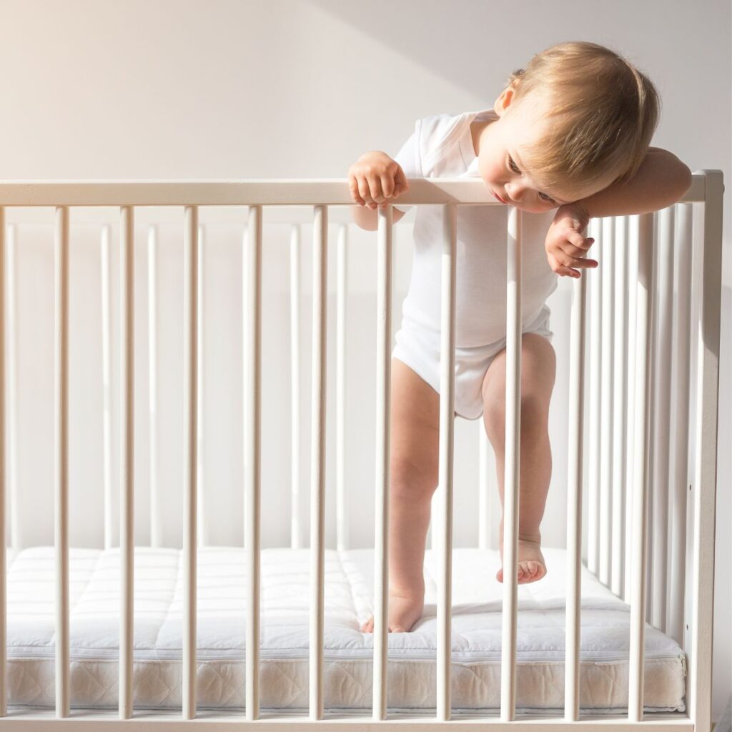 Baby standing in crib