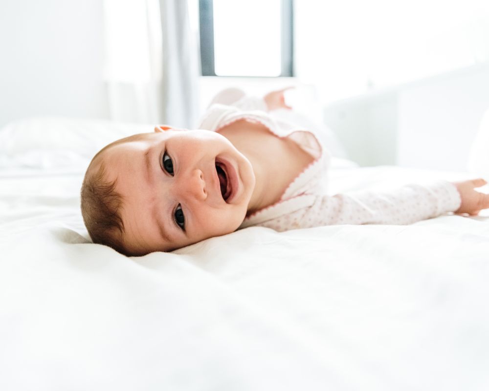 baby rolling from back to front in their crib