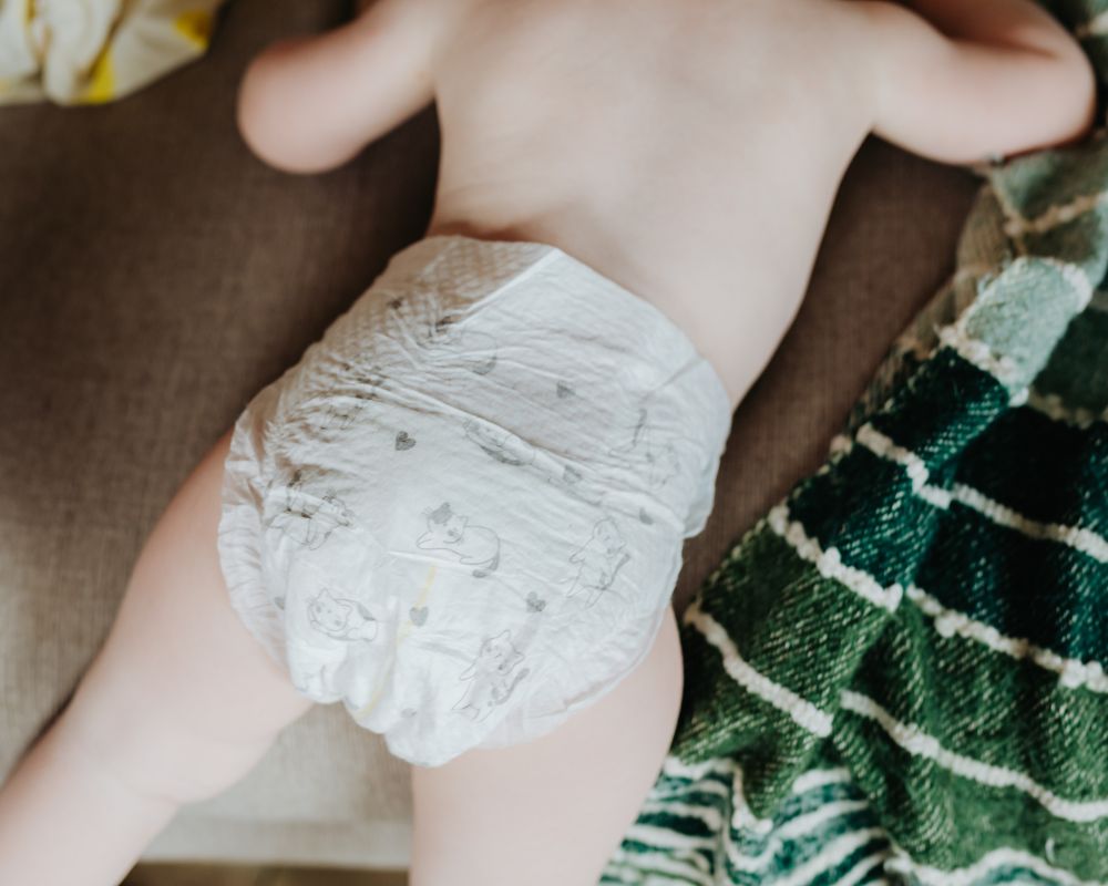 image of baby's back wearing only a diaper