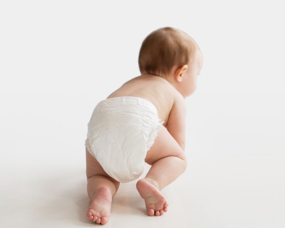 baby crawling in a diaper