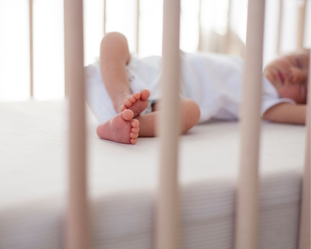 baby sleeping in a crib