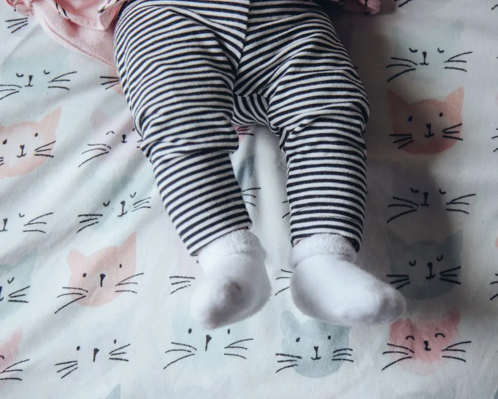 baby's legs on a blanket