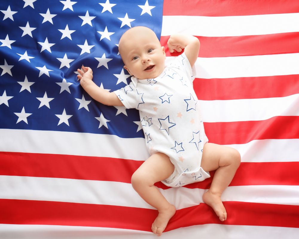baby laying down on an American flag