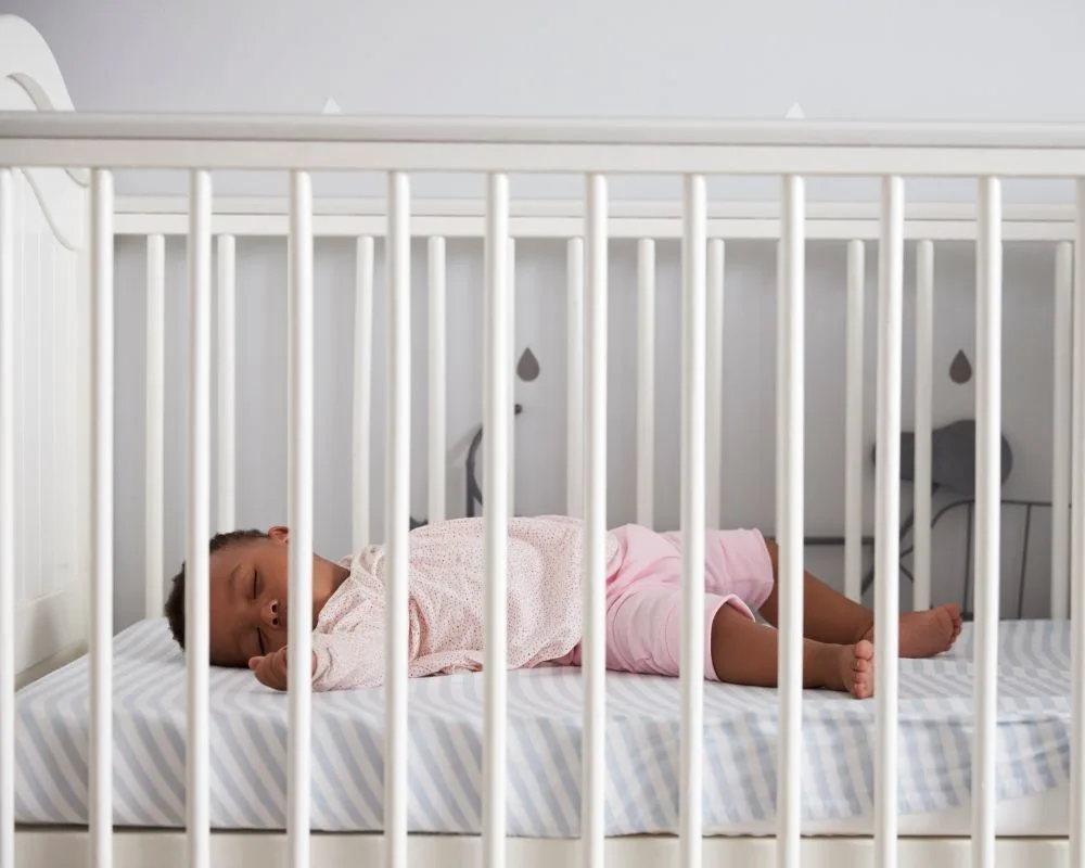 baby asleep in a crib