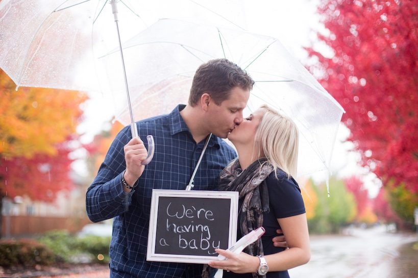 baby announcement with umbrella and baby sign
