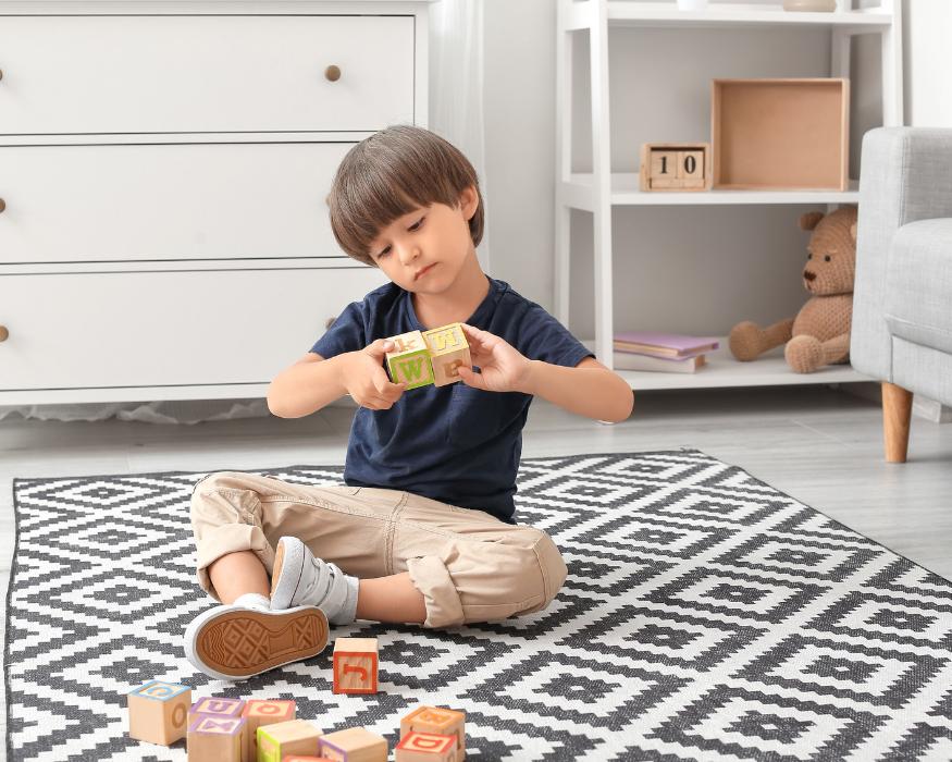 little boy playing with blocks during quiet time