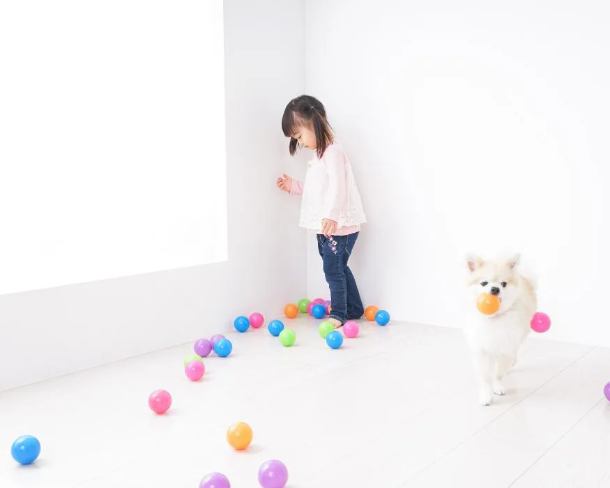 little girl playing with balls during quiet time play