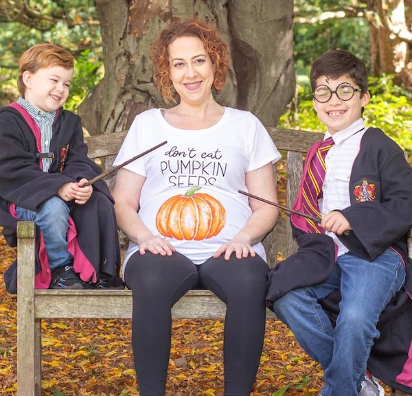 Pregnant mom and brothers doing a Harry Potter inspired pregnancy reveal