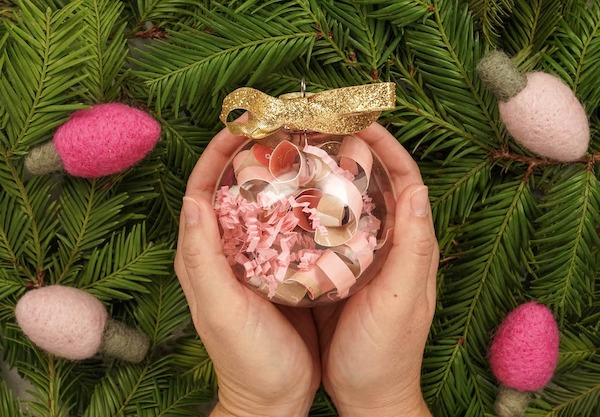 Baby's First Christmas Ornament in hands